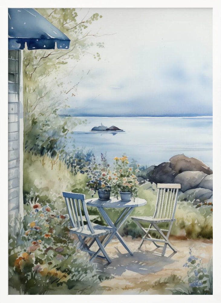 A watercolor painting of a tranquil coastal scene. A light blue bistro table and two matching chairs sit in a lush garden filled with flowers, overlooking a calm body of water. In the distance, a small island is visible under a soft, hazy sky. Part of a house with a blue awning can be seen on the left. Print