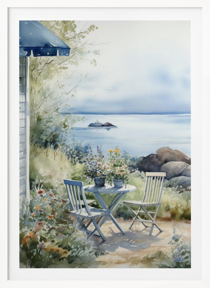 A watercolor painting of a tranquil coastal scene. A light blue bistro table and two matching chairs sit in a lush garden filled with flowers, overlooking a calm body of water. In the distance, a small island is visible under a soft, hazy sky. Part of a house with a blue awning can be seen on the left. Print
