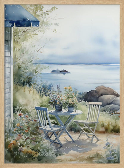A watercolor painting of a tranquil coastal scene. A light blue bistro table and two matching chairs sit in a lush garden filled with flowers, overlooking a calm body of water. In the distance, a small island is visible under a soft, hazy sky. Part of a house with a blue awning can be seen on the left. Print