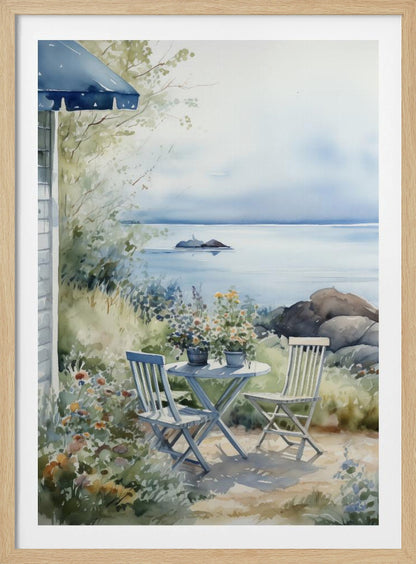A watercolor painting of a tranquil coastal scene. A light blue bistro table and two matching chairs sit in a lush garden filled with flowers, overlooking a calm body of water. In the distance, a small island is visible under a soft, hazy sky. Part of a house with a blue awning can be seen on the left. Print