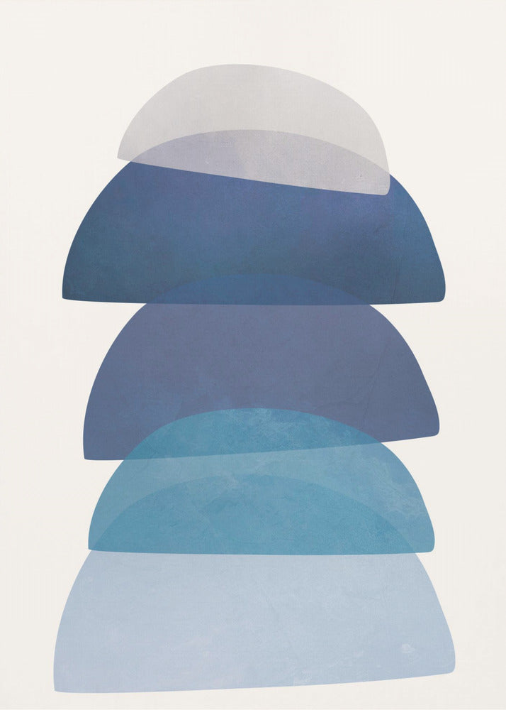 An abstract art print in a black frame, featuring a vertical stack of five semi-circular, dome-like shapes against an off-white background. The shapes are in various shades of blue and gray and have a translucent, overlapping quality, creating a sense of depth and balance. Artwork