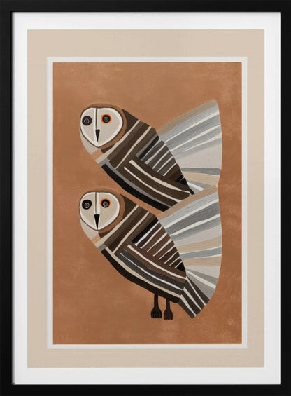 A framed modern art print of two stylized barn owls against a warm brown background. The owls are decorated with geometric stripes in shades of brown, beige, grey, and black, and have large, captivating eyes. Wall Art