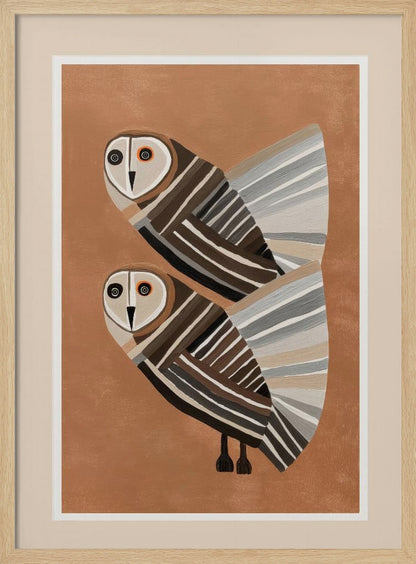 A framed modern art print of two stylized barn owls against a warm brown background. The owls are decorated with geometric stripes in shades of brown, beige, grey, and black, and have large, captivating eyes. Wall Art