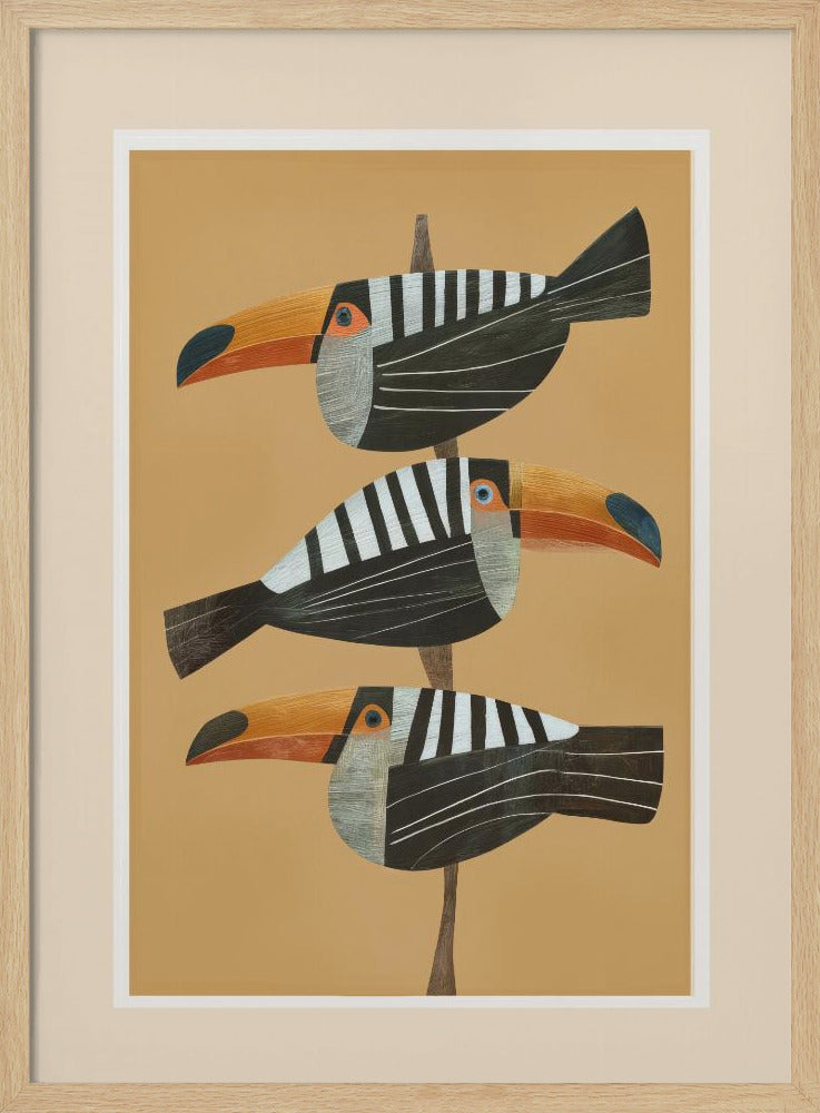 A framed graphic illustration of three stylized toucans perched one above the other on a thin vertical branch. The birds, facing left, have black bodies with bold white vertical stripes, and large, vibrant orange beaks. The background is a solid mustard yellow. Decor
