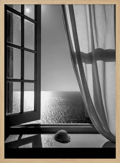 A serene black and white photograph looking out an open paned window at a sunlit ocean. A single seashell rests on the windowsill in the foreground, with shadows cast by the window frame. A light curtain hangs to the right, framing the tranquil sea view. Poster