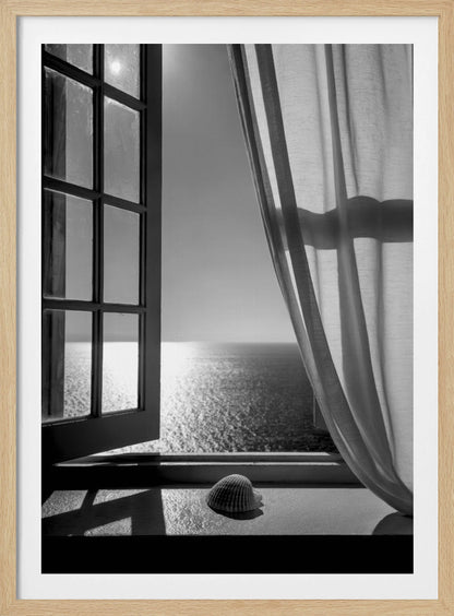 A serene black and white photograph looking out an open paned window at a sunlit ocean. A single seashell rests on the windowsill in the foreground, with shadows cast by the window frame. A light curtain hangs to the right, framing the tranquil sea view. Poster