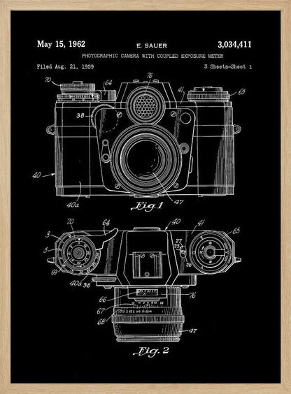 A framed patent illustration of a photographic camera from 1962, presented as a white line drawing on a black background. The poster shows two figures: Fig. 1 is a front view of the camera, and Fig. 2 is a top-down view. Both diagrams are detailed with numbers and lines pointing to various components. The top of the poster includes text with the patent date, inventor's name (E. Sauer), and patent number. Poster