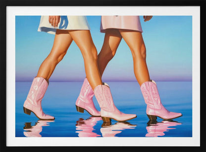 A pop art style painting of the legs of two women wearing matching pink cowboy boots and short skirts, walking across a reflective blue surface that mirrors their steps. The background is a gradient of blue and lavender, and the entire image is contained within a silver frame. Wall Art