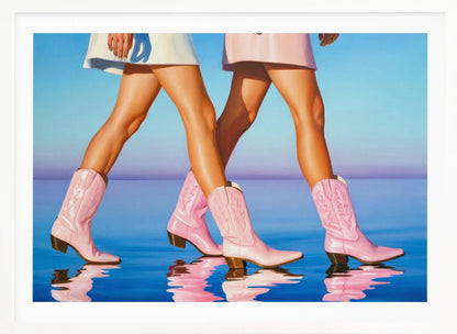A pop art style painting of the legs of two women wearing matching pink cowboy boots and short skirts, walking across a reflective blue surface that mirrors their steps. The background is a gradient of blue and lavender, and the entire image is contained within a silver frame. Wall Art