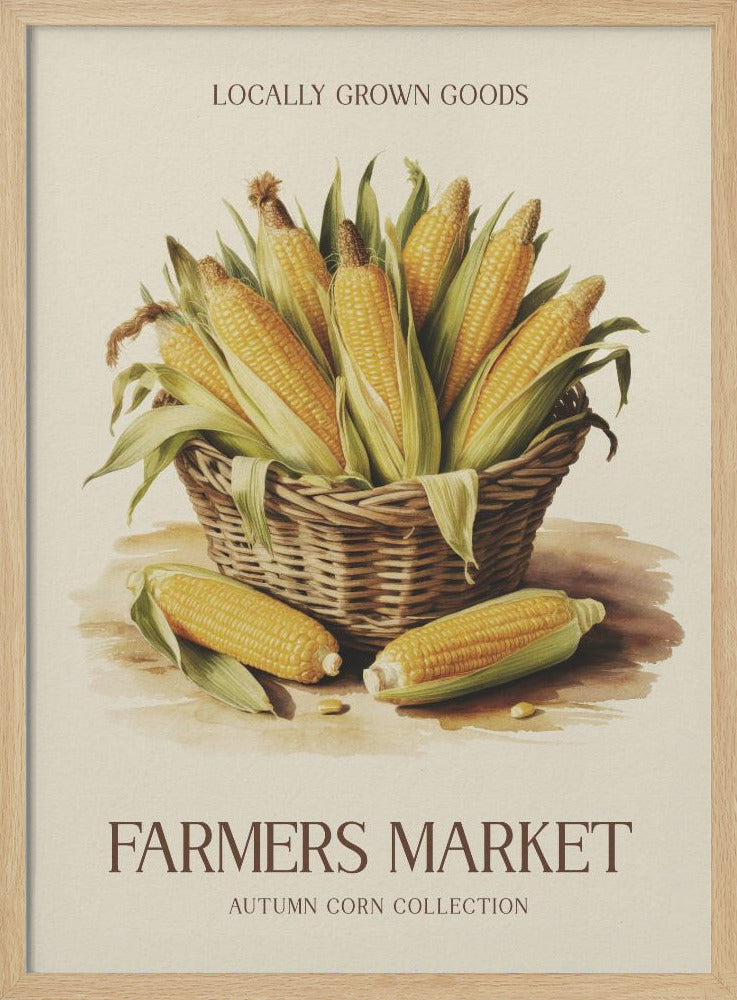 A vintage-style art print with a black frame featuring a wicker basket full of ears of corn. The poster has text that reads 'LOCALLY GROWN GOODS' at the top and 'FARMERS MARKET AUTUMN CORN COLLECTION' at the bottom. The background is a light cream color. Artwork