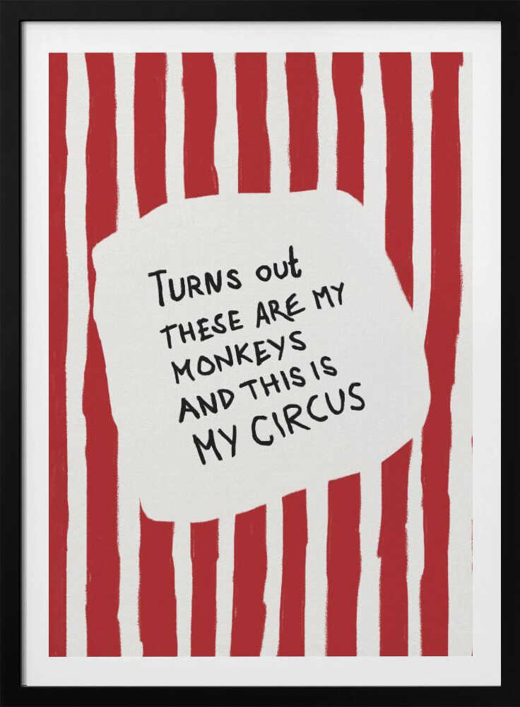 A framed art print featuring the humorous quote 'Turns out these are my monkeys and this is my circus' in black handwritten text. The text is centered on a white, cloud-like shape against a background of bold, hand-painted red and white vertical stripes, reminiscent of a circus tent. Poster