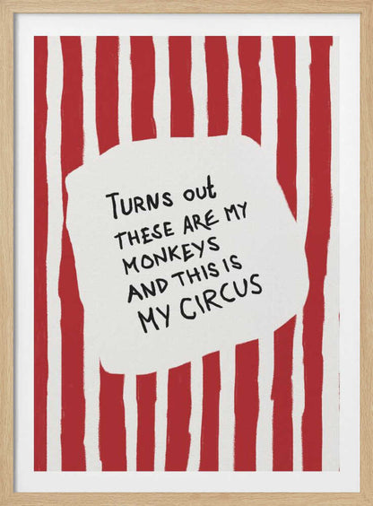 A framed art print featuring the humorous quote 'Turns out these are my monkeys and this is my circus' in black handwritten text. The text is centered on a white, cloud-like shape against a background of bold, hand-painted red and white vertical stripes, reminiscent of a circus tent. Poster