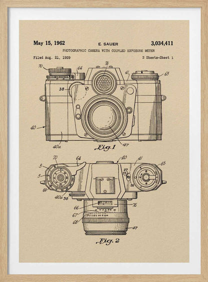 A framed vintage patent illustration from 1962 for a photographic camera with an exposure meter, showing detailed front and top-down technical drawings in black ink on aged beige paper. Decor