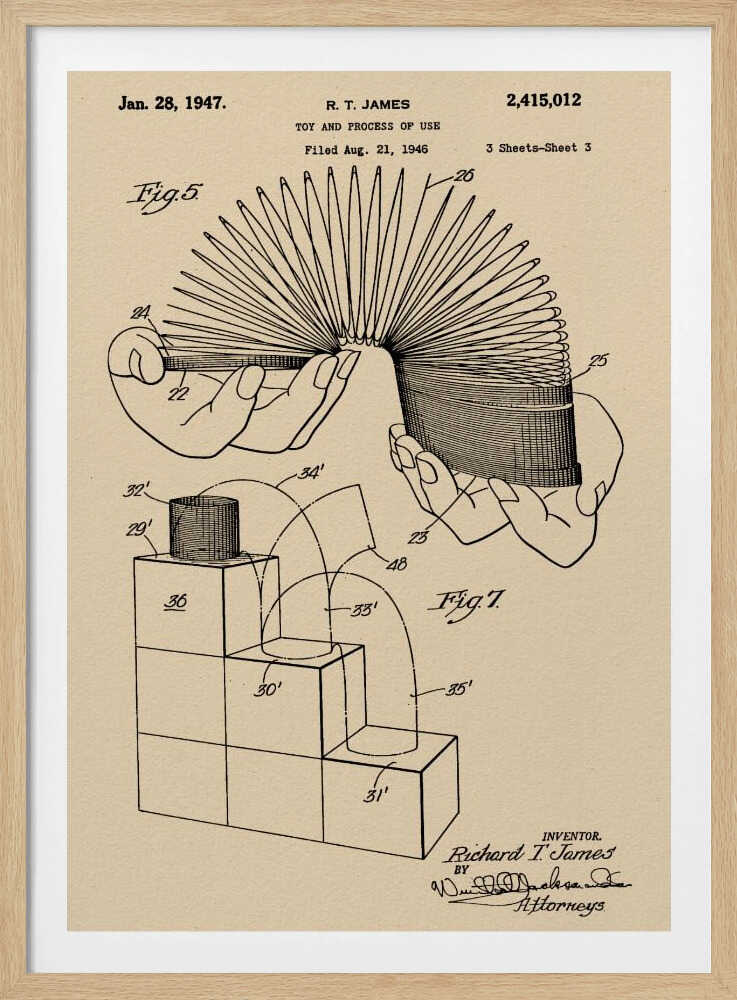 A framed vintage patent illustration for the Slinky toy on beige paper. The drawing, dated 1947, shows two diagrams: one with hands stretching the coiled spring toy, and another demonstrating the toy 'walking' down a set of blocks. Wall Art