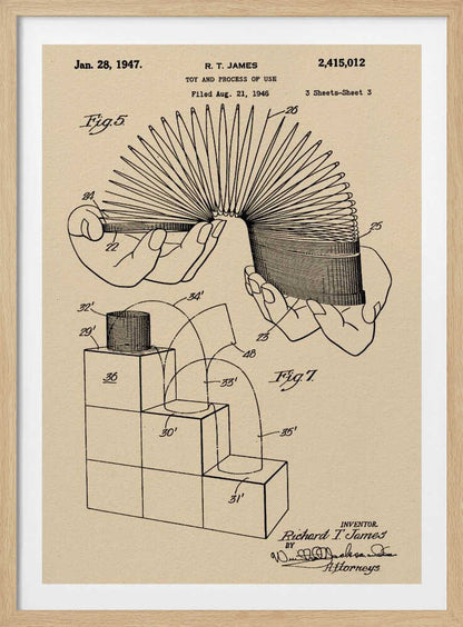 A framed vintage patent illustration for the Slinky toy on beige paper. The drawing, dated 1947, shows two diagrams: one with hands stretching the coiled spring toy, and another demonstrating the toy 'walking' down a set of blocks. Wall Art