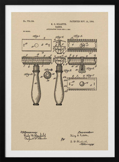 A framed vintage patent illustration for a razor invented by K. C. Gillette, dated November 15, 1904. The technical drawing on a beige background shows various figures and parts of the safety razor, with handwritten-style text and signatures at the bottom. Poster