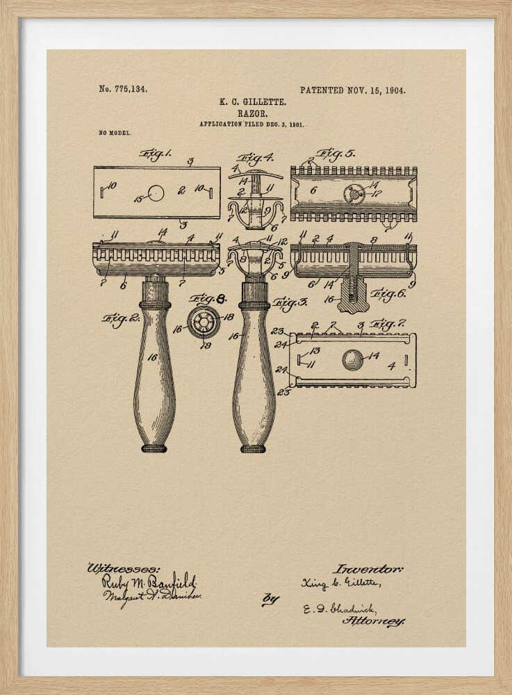 A framed vintage patent illustration for a razor invented by K. C. Gillette, dated November 15, 1904. The technical drawing on a beige background shows various figures and parts of the safety razor, with handwritten-style text and signatures at the bottom. Poster