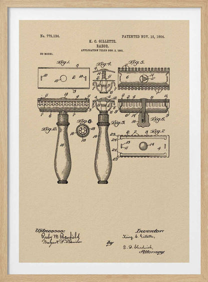 A framed vintage patent illustration for a razor invented by K. C. Gillette, dated November 15, 1904. The technical drawing on a beige background shows various figures and parts of the safety razor, with handwritten-style text and signatures at the bottom. Poster