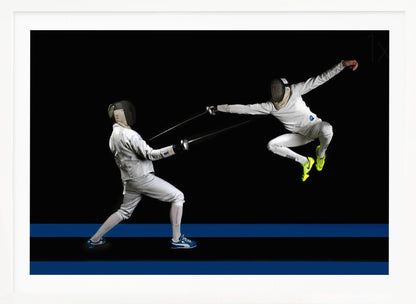 A dynamic action shot of two fencers in full white gear and masks dueling with foils against a stark black background. The fencer on the right is captured mid-air in a dramatic leap, while the fencer on the left lunges forward on a surface marked with blue lines. The image is enclosed in a silver frame. Artwork