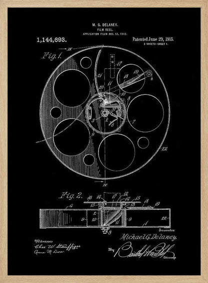 A framed black and white patent illustration for a film reel, invented by M. G. Delaney in 1912. The drawing, presented as a negative image with white lines on a black background, shows detailed schematics of the reel's mechanism from a top-down view (Fig. 1) and a cross-section (Fig. 2). Poster
