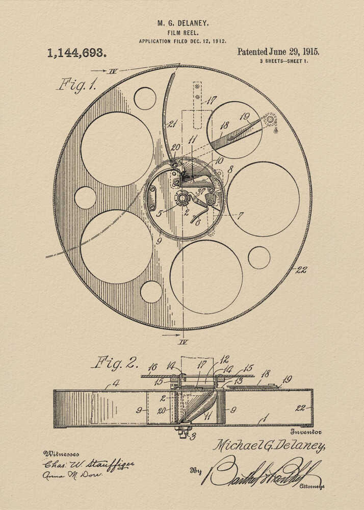 A framed vintage patent illustration of a film reel from 1915 by M.G. Delaney. The drawing is in black ink on a beige background, showing detailed schematics of the reel's mechanics from two different angles, complete with numbered parts, signatures, and patent information. Wall Art