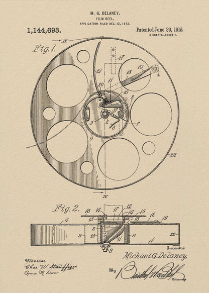 A framed vintage patent illustration of a film reel from 1915 by M.G. Delaney. The drawing is in black ink on a beige background, showing detailed schematics of the reel's mechanics from two different angles, complete with numbered parts, signatures, and patent information. Wall Art