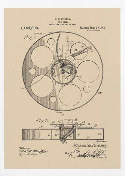 A framed vintage patent illustration of a film reel from 1915 by M.G. Delaney. The drawing is in black ink on a beige background, showing detailed schematics of the reel's mechanics from two different angles, complete with numbered parts, signatures, and patent information. Wall Art