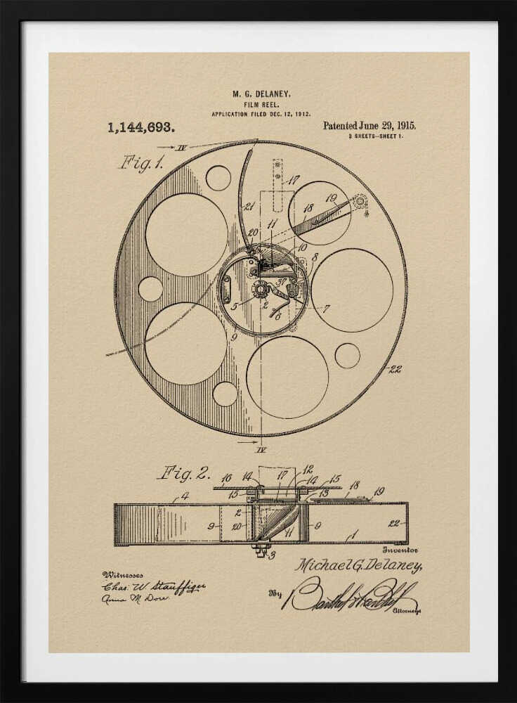 A framed vintage patent illustration of a film reel from 1915 by M.G. Delaney. The drawing is in black ink on a beige background, showing detailed schematics of the reel's mechanics from two different angles, complete with numbered parts, signatures, and patent information. Wall Art