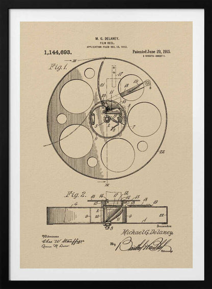 A framed vintage patent illustration of a film reel from 1915 by M.G. Delaney. The drawing is in black ink on a beige background, showing detailed schematics of the reel's mechanics from two different angles, complete with numbered parts, signatures, and patent information. Wall Art
