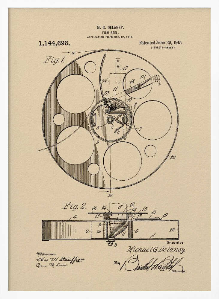 A framed vintage patent illustration of a film reel from 1915 by M.G. Delaney. The drawing is in black ink on a beige background, showing detailed schematics of the reel's mechanics from two different angles, complete with numbered parts, signatures, and patent information. Wall Art