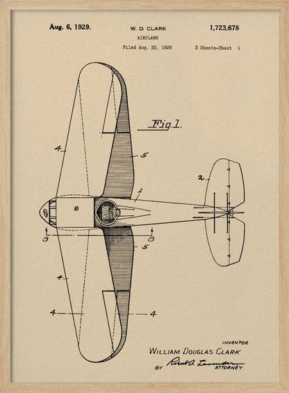 A framed vintage patent illustration of an airplane designed by W. D. Clark, dated August 6, 1929. The image shows a top-down schematic view of the aircraft in black ink on an aged, beige paper background, with various parts labeled with numbers. Text and signatures are visible, characteristic of an official patent document. Decor