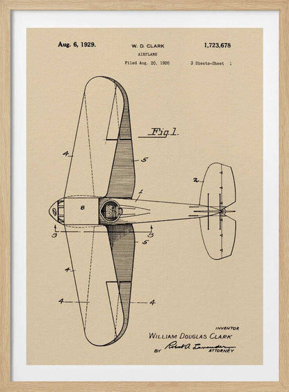A framed vintage patent illustration of an airplane designed by W. D. Clark, dated August 6, 1929. The image shows a top-down schematic view of the aircraft in black ink on an aged, beige paper background, with various parts labeled with numbers. Text and signatures are visible, characteristic of an official patent document. Decor
