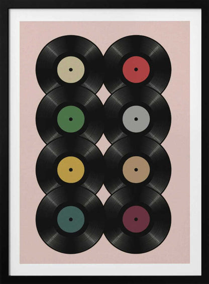 A graphic art print featuring eight black vinyl records arranged in two columns of four against a pale pink background. Each record has a different solid-colored label, creating a colorful and retro pattern. The artwork is enclosed in a simple black frame. Artwork