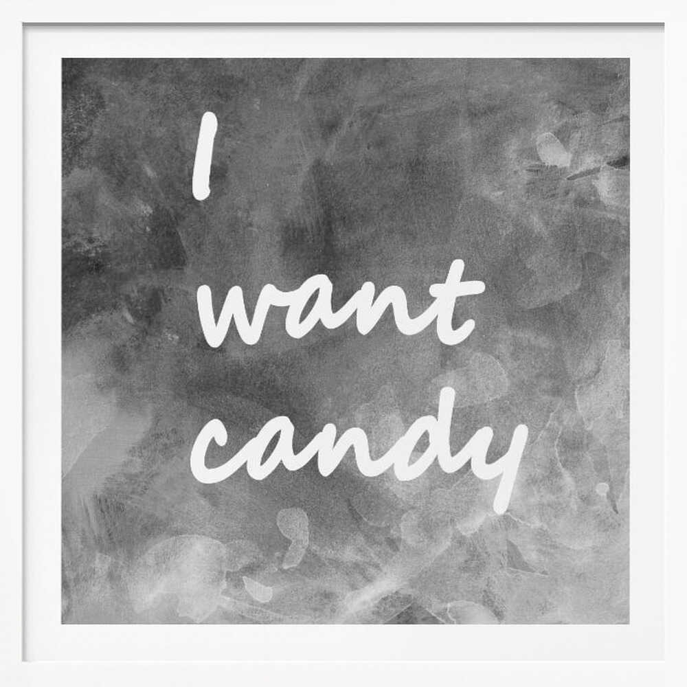 A framed typography art piece with a light brown wood frame. It features the phrase 'I want candy' in a white, handwritten script against a textured, dark gray and white chalkboard-style background. Wall Art