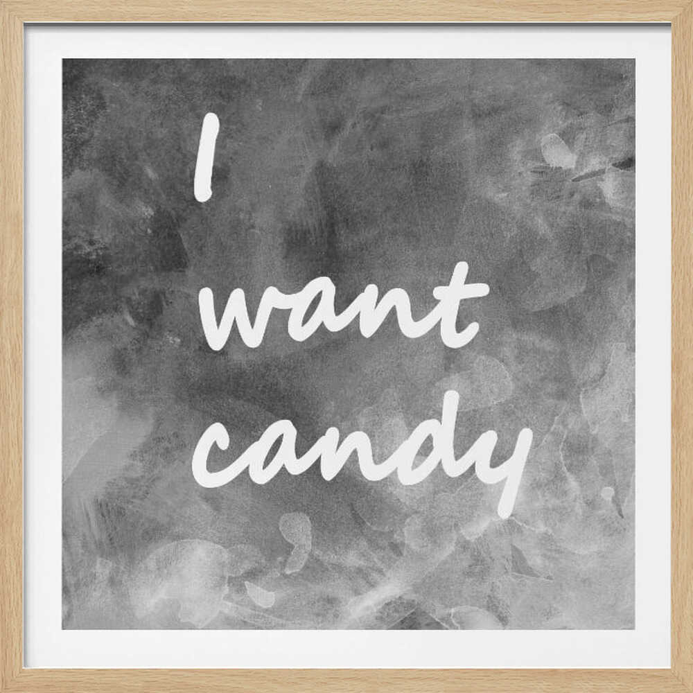 A framed typography art piece with a light brown wood frame. It features the phrase 'I want candy' in a white, handwritten script against a textured, dark gray and white chalkboard-style background. Wall Art