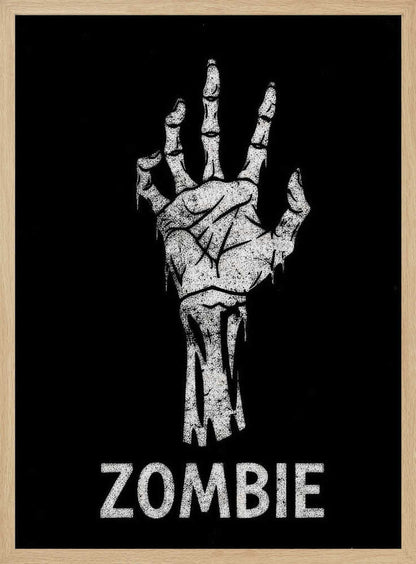A black and white graphic of a distressed, skeletal zombie hand reaching up against a solid black background. Below the hand, the word 'ZOMBIE' is written in a bold, distressed font. The entire image is bordered by a thin black frame. Decor