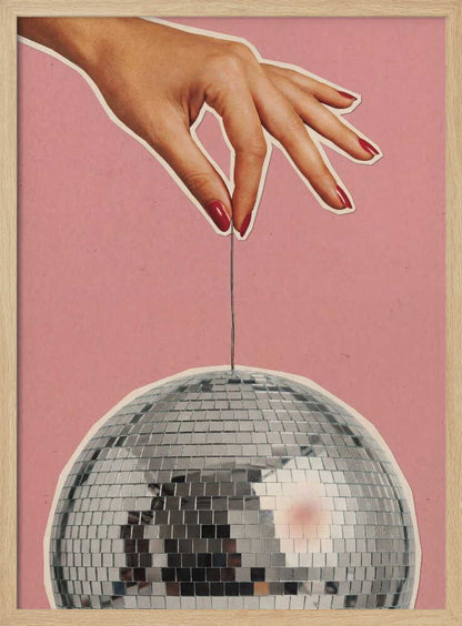 Retro collage art of a hand with red nails holding a silver disco ball against a pink background.