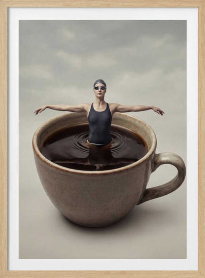 Surreal art print of a woman in a swimsuit swimming in a giant cup of coffee.