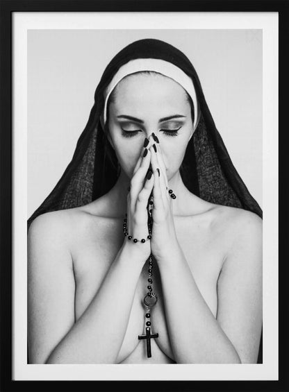 A black and white portrait of a woman with dramatic eye makeup wearing a nun's habit. Her eyes are closed and her hands are clasped in front of her face in prayer, holding a black rosary. Her shoulders are bare, creating a stark contrast. Artwork