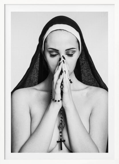 A black and white portrait of a woman with dramatic eye makeup wearing a nun's habit. Her eyes are closed and her hands are clasped in front of her face in prayer, holding a black rosary. Her shoulders are bare, creating a stark contrast. Artwork
