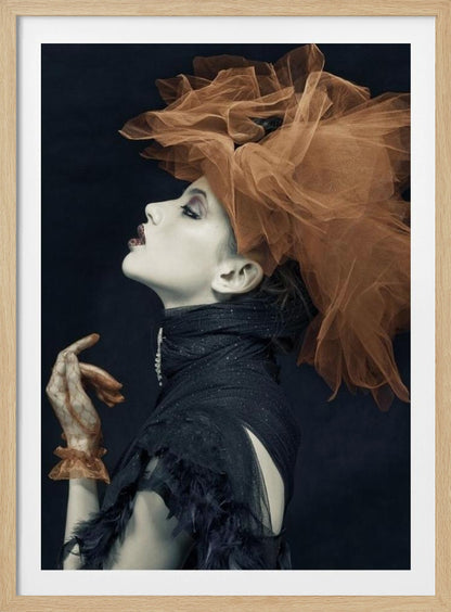 A dramatic profile portrait of a woman with pale skin against a black background, looking up. She wears an extravagant, voluminous orange tulle headpiece, a high-collared black feathered dress, and a matching orange glove. Poster