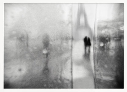 A framed, moody black and white photograph with a heavy blur effect, depicting a couple's silhouette walking towards the distant, hazy Eiffel Tower on what appears to be a rainy day in Paris. Artwork