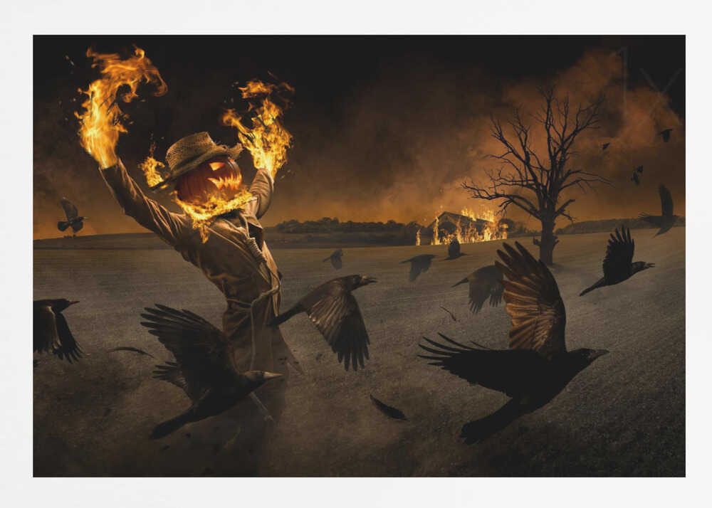 A terrifying scarecrow with a glowing jack-o'-lantern for a head stands in a dark field, its hands engulfed in flames raised towards the sky. A flock of black crows flies around it in a frenzy, while in the background, a barn burns under a dark, smoky orange sky. Wall Art