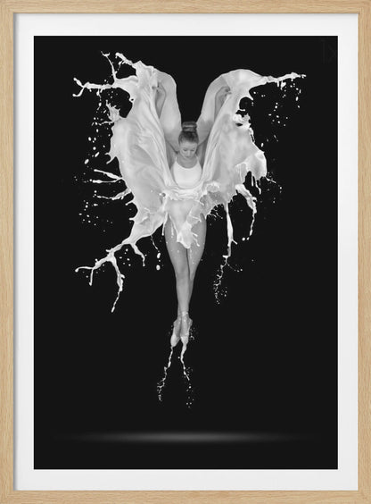 A dramatic black and white photograph of a ballerina suspended in mid-air against a black background. She is en pointe, and a dynamic splash of white liquid surrounds her, creating the illusion of wings. Artwork