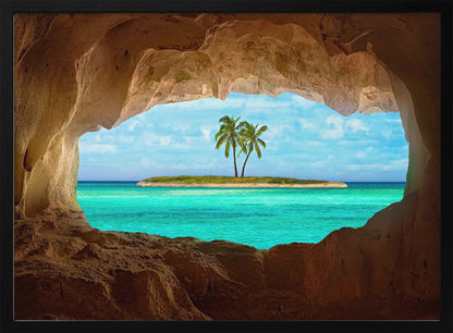 A framed artwork depicting a view from inside a rocky cave looking out at a small tropical island with two palm trees. The cave's natural arch frames the vibrant turquoise ocean and the bright blue sky, creating a sense of a hidden paradise. Artwork