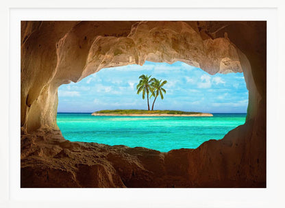 A framed artwork depicting a view from inside a rocky cave looking out at a small tropical island with two palm trees. The cave's natural arch frames the vibrant turquoise ocean and the bright blue sky, creating a sense of a hidden paradise. Artwork