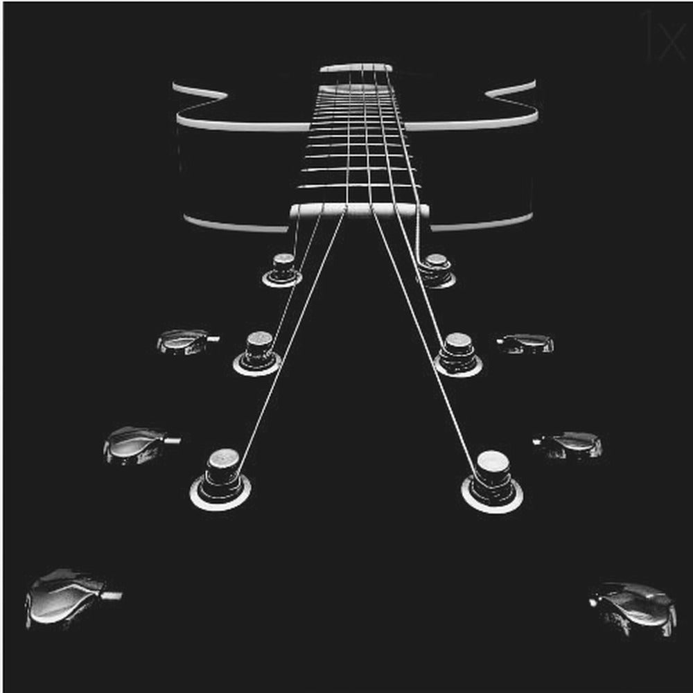 A dramatic, low-angle, black and white photograph of an electric guitar. The perspective looks up from the headstock, with the shiny tuning pegs and strings creating strong leading lines towards the fretboard and body, which are outlined in white against a solid black background. Poster
