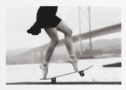 A black and white photograph of a ballerina's legs in a black dress, balancing en pointe on a skateboard with a blurred bridge in the background. Artwork