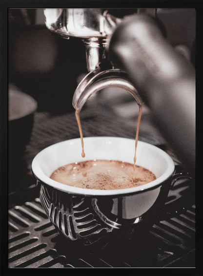 A close-up, desaturated photograph of an espresso machine pouring two streams of rich brown coffee from a chrome portafilter into an ornate black and white cup. Poster