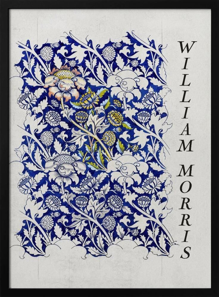 A vintage art print by William Morris featuring an intricate blue and white floral pattern on a light gray, textured background. The design swatch shows stylized flowers and acanthus leaves, with some central flowers highlighted in yellow and peach. The name 'WILLIAM MORRIS' is printed vertically in a black serif font along the right edge. The print is displayed in a thin black frame. Decor